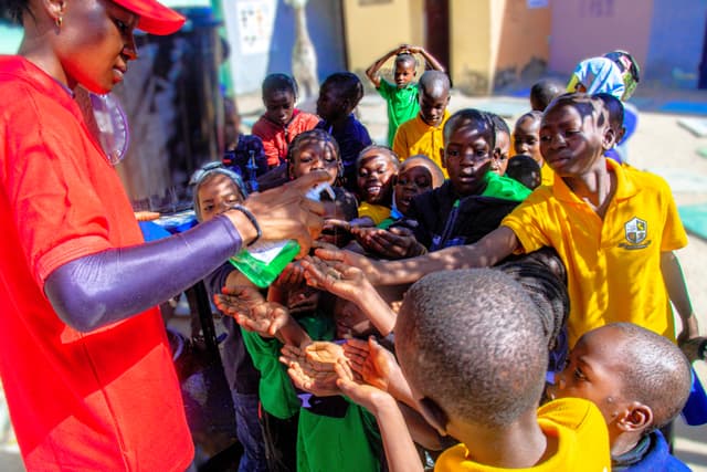 Child accessing clean water โ WASH program